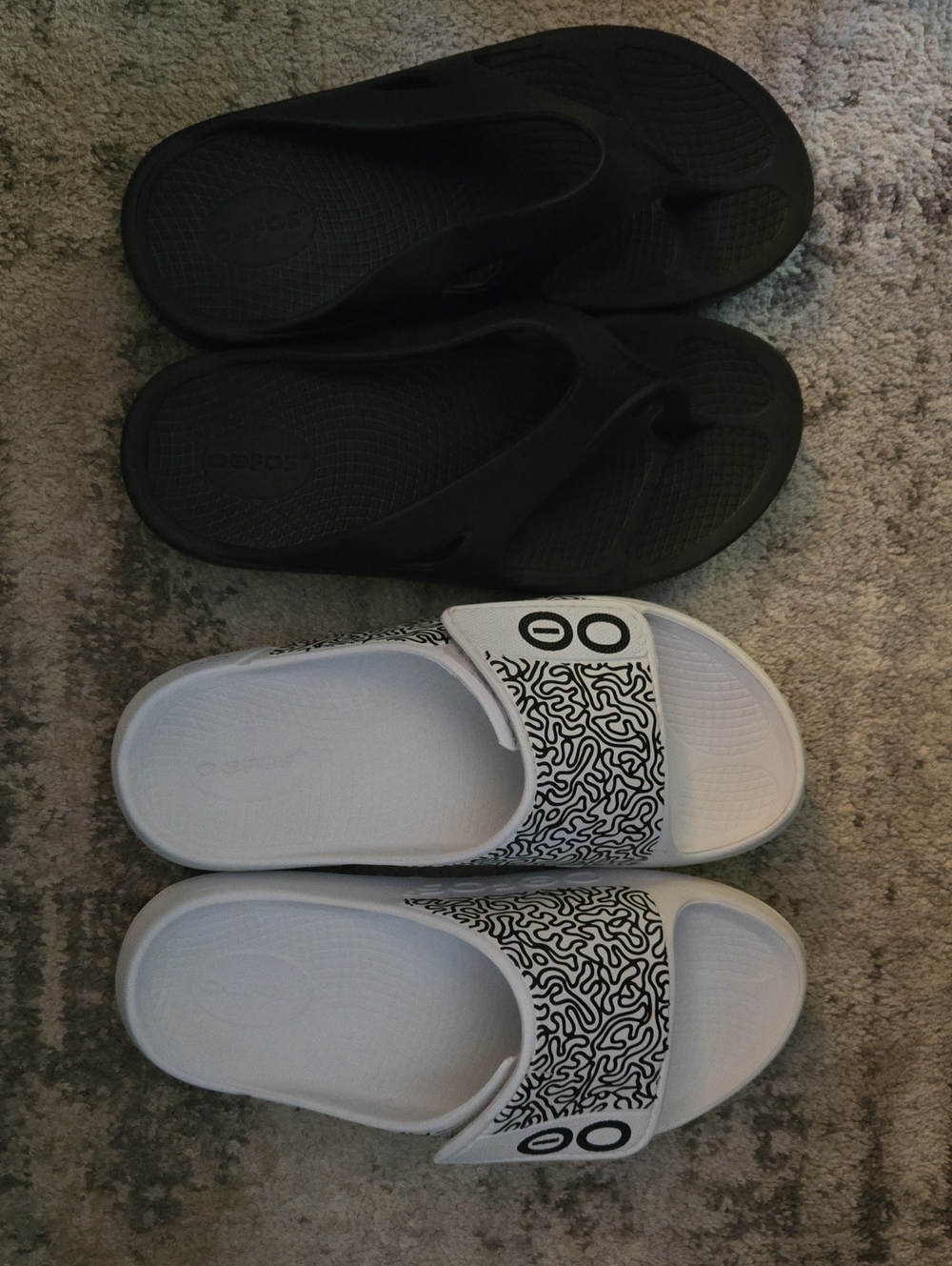 OOFOS Black Flip Flops & White Patterned Slide Sandals